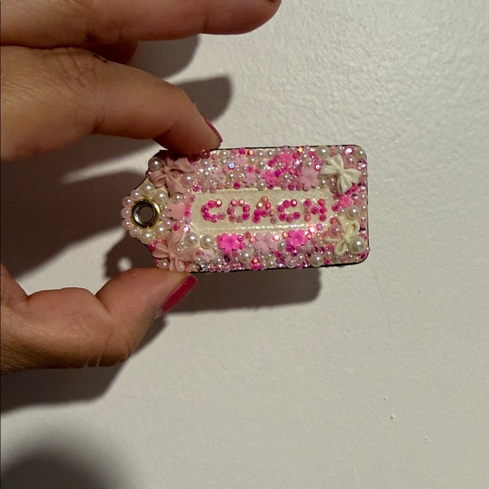 Coach white hangtag embellished with white pink pearl